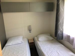 Postel nebo postele na pokoji v ubytování Mobilhome + 1 fotografie