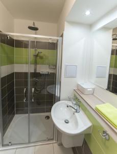 a bathroom with a sink and a shower at Apartment AndruL in Frymburk