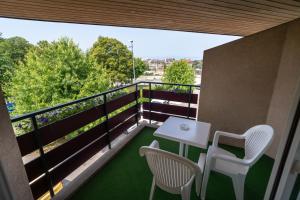 Balkón nebo terasa v ubytování Logis Hotel Arc En Ciel