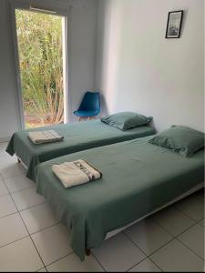 Ένα ή περισσότερα κρεβάτια σε δωμάτιο στο Appartement