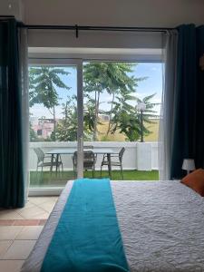 a bedroom with a bed and a view of a table at Bella Ischia in Ischia +50 photos