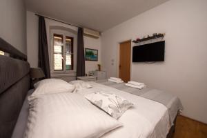 Postel nebo postele na pokoji v ubytování Split Ann Apartments