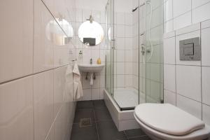 Koupelna v ubytování Split Ann Apartments + 25 fotografií