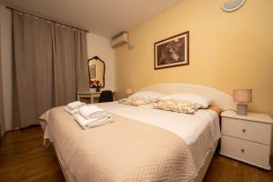Postel nebo postele na pokoji v ubytování Split Ann Apartments