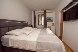 Postel nebo postele na pokoji v ubytování Split Ann Apartments