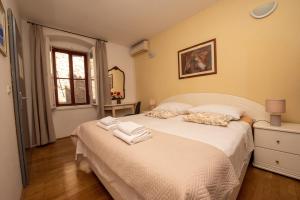 Postel nebo postele na pokoji v ubytování Split Ann Apartments