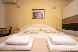 Postel nebo postele na pokoji v ubytování Split Ann Apartments