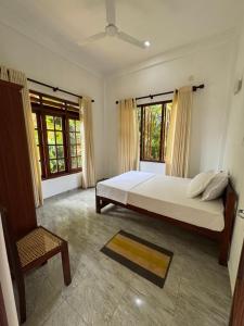 Ένα ή περισσότερα κρεβάτια σε δωμάτιο στο Villa Thasha