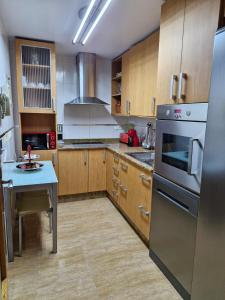 Kuchyň nebo kuchyňský kout v ubytování Apartamento Acequia Aljada