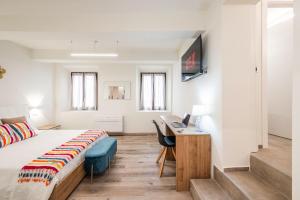 Voodi või voodid majutusasutuse Maison La Pomposa Suite toas