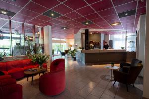 Posezení v ubytování Logis Hotel Arc En Ciel