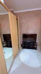 a room with two open doors and a fireplace at Gloryapartement in Roeselare