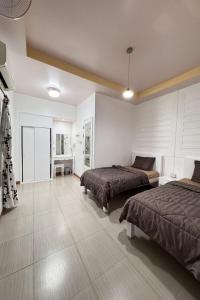 Postel nebo postele na pokoji v ubytování Ban Suan Suree Resort