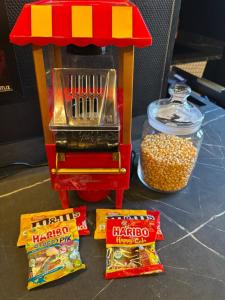a lego food stand with popcorn and snacks on a table at Appartement centre ville Laval avec cinéma in Laval