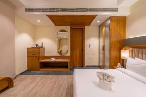 Lova arba lovos apgyvendinimo įstaigoje Excel Hotels & Resorts, Corbett