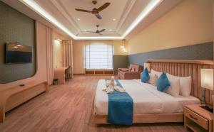 Lova arba lovos apgyvendinimo įstaigoje Excel Hotels & Resorts, Corbett