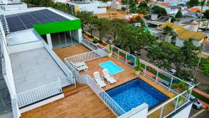 an overhead view of a house with a swimming pool at Hotel Greenville by Slim Hotéis in Primavera do Leste