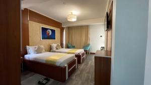 Postel nebo postele na pokoji v ubytování Abaት Guest House