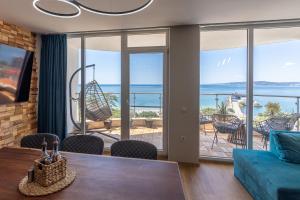 a living room with a view of the ocean at Luxury Apartments Calithea-Balchik, Free Parking in Balchik