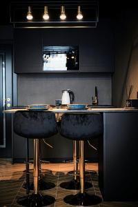 Et tv og/eller underholdning på Black IN Palangos loftai