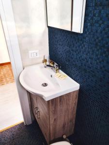 a bathroom with a sink and a mirror at Al Mari Suites in Ponza +46 photos