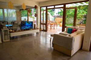 a living room with a couch and a tv at Milies Apartments in Stavros