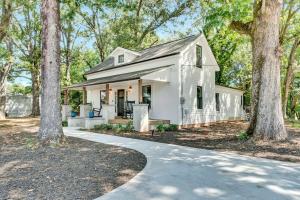 a white house with trees in front of it at Welcome to Villa Rosa Farmhouse in Piedmont
