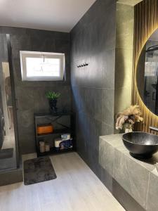 a bathroom with a sink and a mirror at Квартира в историческом центре Одессы in Odesa