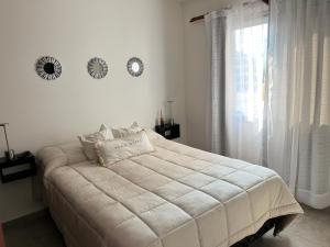 Giường trong phòng chung tại Departamento Bv carcano - costanera !! +20 ảnh