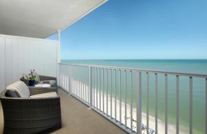a balcony with a view of the ocean at La Playa Beach & Golf Resort, a Noble House Resort in Naples