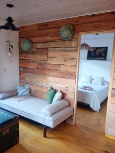 a room with two beds and a couch in it at La Postal de Chapa in Chapadmalal
