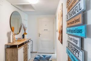 a hallway with signs on the wall in a house at Ferienwohnung Montana Amor in Prutz