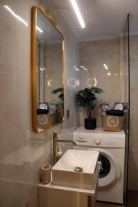 a bathroom with a washing machine and a mirror at Superior Petit Studio in Mytilini +72 photos