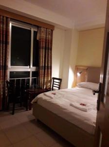 Postel nebo postele na pokoji v ubytování Mekelle Hotel