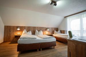 Postel nebo postele na pokoji v ubytování Hotel Restaurant Perschler