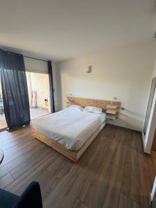 Ένα ή περισσότερα κρεβάτια σε δωμάτιο στο Appartements PORTICCIO CENTRE