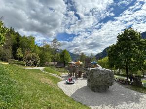 a playground with a ride in a park at Zillertalerhütte in Aschau