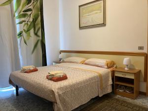 a bedroom with a bed with two bags on it at Tuscany Nature Relax in Pieve Santo Stefano