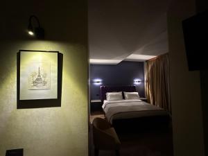 Postel nebo postele na pokoji v ubytování Hotel Epidami
