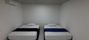 Postel nebo postele na pokoji v ubytování Hotel Roy