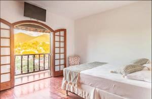 Postel nebo postele na pokoji v ubytování Casa agradável no centro de Miguel Pereira