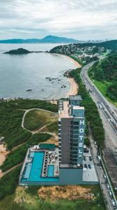 an aerial view of a building next to a beach at Hotel Blue Sea in Itapema