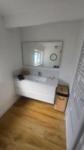a bathroom with a sink and a mirror at Le Gîte de Clément avec Spa privatif in Courset +13 photos