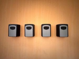 a wall with four different types of toasters on it at Penzion Estetika in Jaroslavice