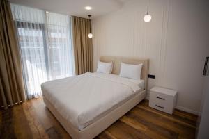 Ένα ή περισσότερα κρεβάτια σε δωμάτιο στο White Tower Apartments +49 φωτογραφίες