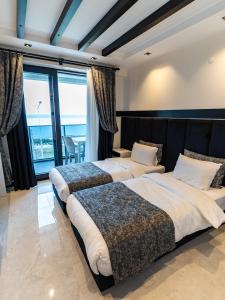 Katil atau katil-katil dalam bilik di Çanakkale Ornella Otel +115 gambar