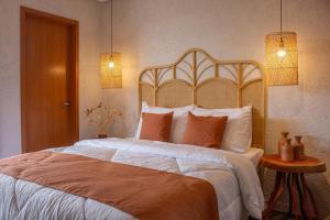 En eller flere senge i et værelse på Casa Sapê 14 - Milagres + 30 billeder