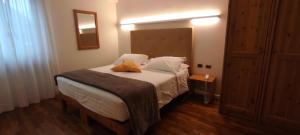 Postel nebo postele na pokoji v ubytování Hotel Lilla'