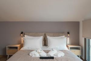 En eller flere senge i et værelse på Ertha Retreat Homes + 40 billeder