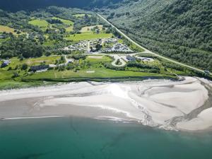 an aerial view of a beach and the ocean at Storviksanden Camping in Storvik